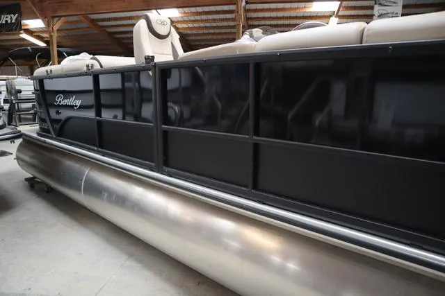 Slide: The Image of 2024 Bentley Pontoons Legacy 220 Navigator interior with luxurious seating and modern design. - 5