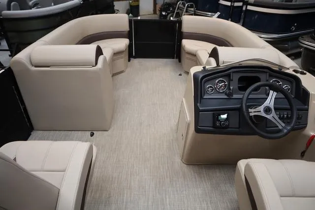 Slide: The Image of 2024 Bentley Pontoons Legacy 220 Navigator dashboard with steering wheel and control panel. - 9
