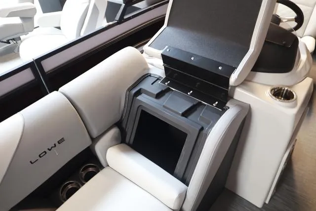 Slide: The Image of 2025 Lowe SS 230 WV boat interior with storage compartment and seating. - 15