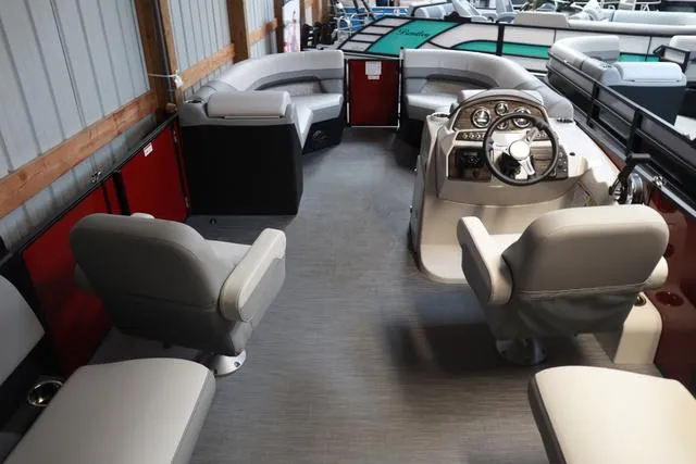 Slide: The Image of 2025 Lowe SS 230 WV Special Triple Tube Package interior with plush seating and modern helm. - 18