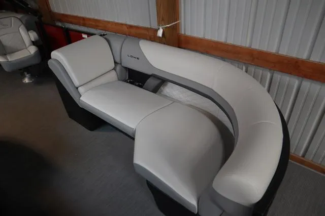 Slide: The Image of 2025 Lowe SS 230 WV boat dashboard with steering wheel and control panel. - 3