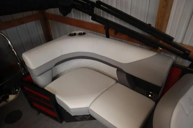 Slide: The Image of 2025 Lowe SS 230 WV boat interior with steering console and comfortable seating. - 6
