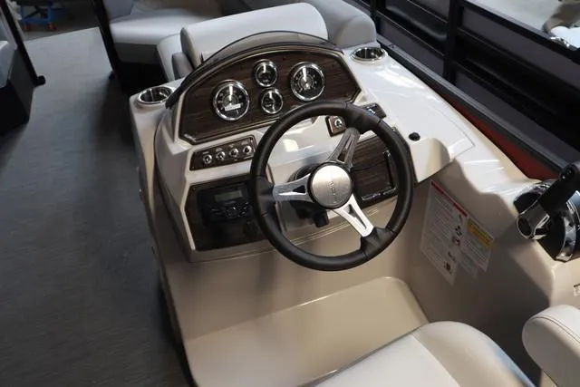 Slide: The Image of 2025 Lowe SS 230 WV Special Triple Tube pontoon boat on gravel lot. - 9