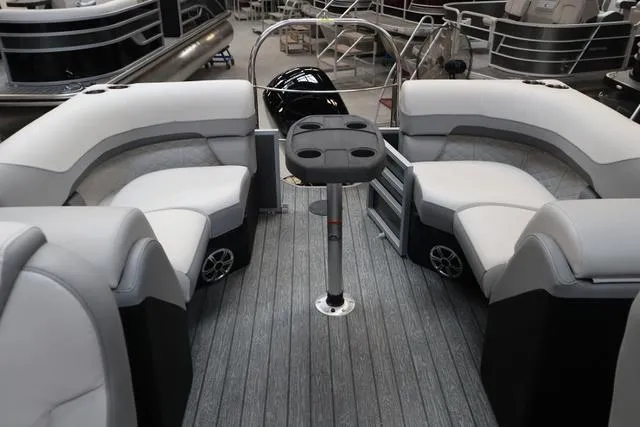 Slide: The Image of 2025 Lowe SS 230 WT Triple Tube Package boat interior with seating and table. - 3