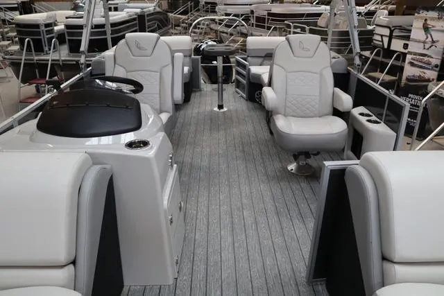 Slide: The Image of 2025 Lowe SS 230 WT Triple Tube pontoon boat interior with plush seating and modern design. - 4