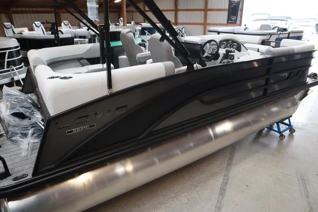 Slide: The Image of 2025 Lowe SS 230 WT Triple Tube pontoon boat in showroom, side view. - 5
