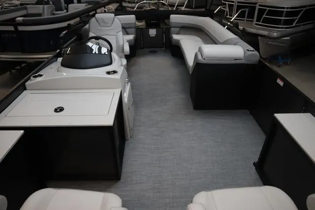 Slide: The Image of 2025 Lowe SF 212 WT Triple Tube Pkg pontoon boat interior with spacious seating and helm. - 8