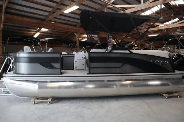 Slide: The Image of 2025 Lowe SF 212 WT Triple Tube pontoon boat in a storage facility. - 9