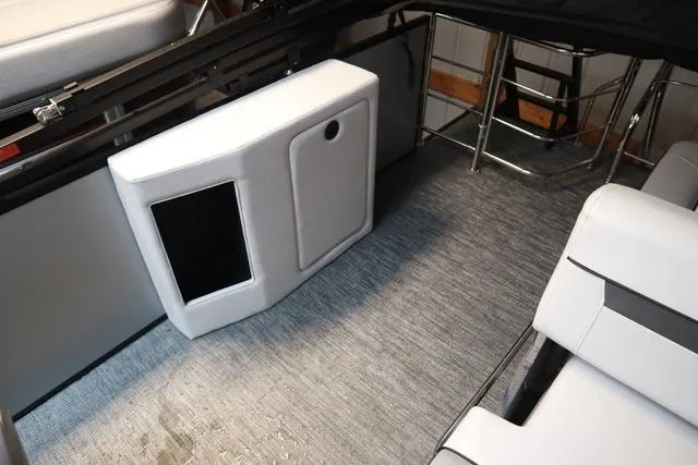 Slide: The Image of Interior of 2024 Godfrey Sweetwater 2286 SFL Triple Tube Package, featuring seating and storage. - 14
