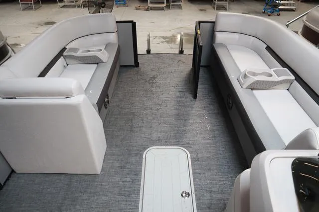 Slide: The Image of 2024 Godfrey Sweetwater 2286 SFL boat interior with spacious seating and cup holders. - 5