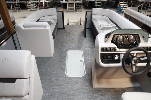 Slide: The Image of 2024 Godfrey Sweetwater 2286 SFL Triple Tube pontoon boat interior with modern helm and seating. - 6