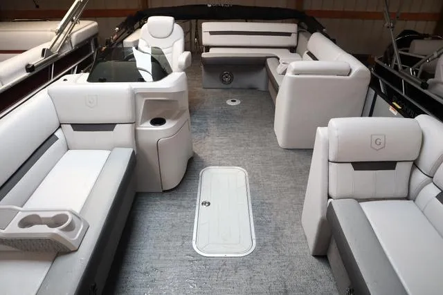 Slide: The Image of 2024 Godfrey Sweetwater 2286 SFL boat interior with plush seating and modern design. - 7