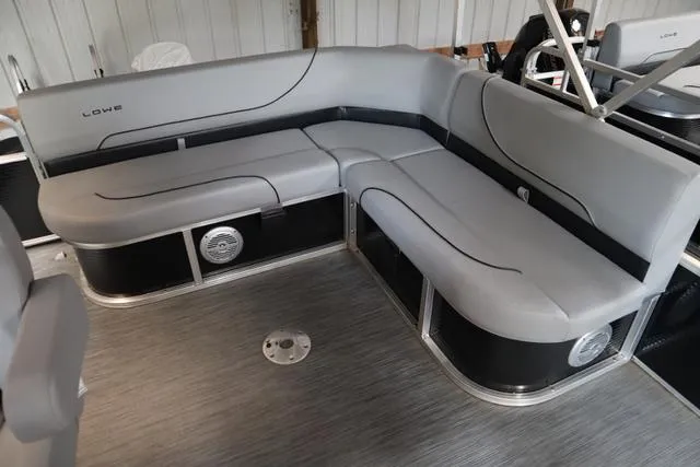 Slide: The Image of 2023 Lowe Ultra Cruise 160 boat interior with gray seating and modern design. - 6