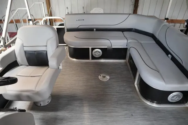 Slide: The Image of 2023 Lowe Ultra Cruise 160 boat interior with gray seating and modern design. - 8