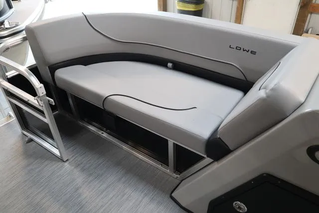 Slide: The Image of 2023 Lowe Ultra Cruise 160 boat interior with sleek gray seating. - 9