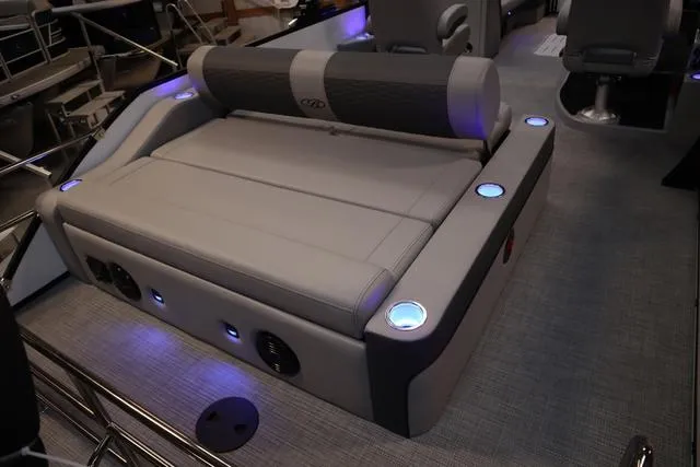 Slide: The Image of 2025 Bentley Pontoons Elite 253 Swingback interior with illuminated seating and modern design. - 11