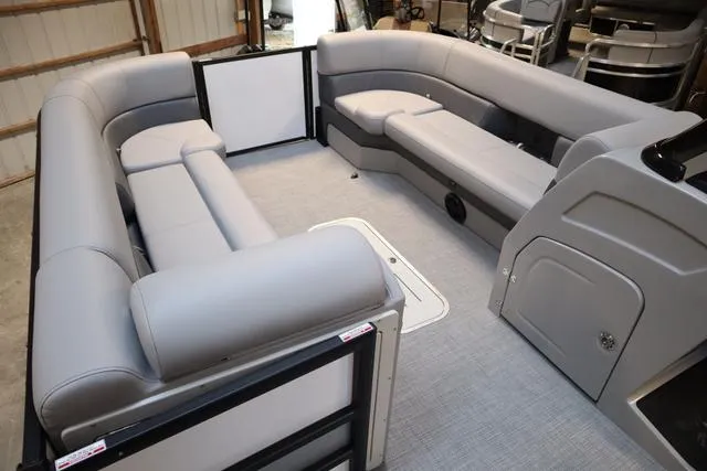 Slide: The Image of 2025 Bentley Pontoons Elite 253 interior with gray seating and spacious layout. - 12