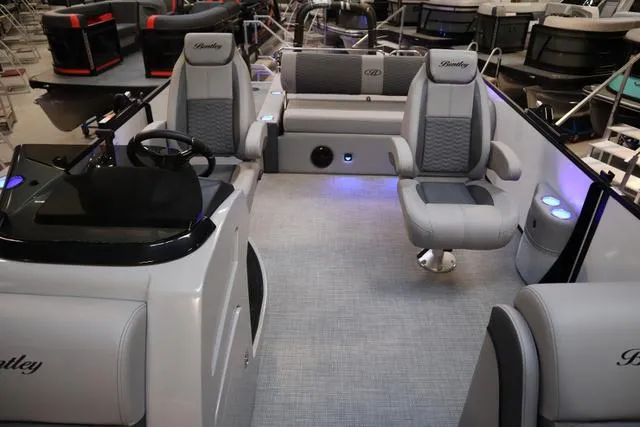 Slide: The Image of 2025 Bentley Pontoons Elite 253 Swingback interior with luxurious seating and modern design. - 18