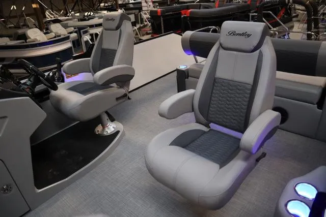 Slide: The Image of 2025 Bentley Pontoons Elite 253 interior with luxurious seating and modern design. - 19