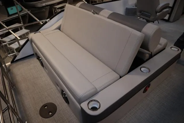 Slide: The Image of 2025 Bentley Pontoons Elite 253 Swingback interior with luxurious seating and cup holders. - 31