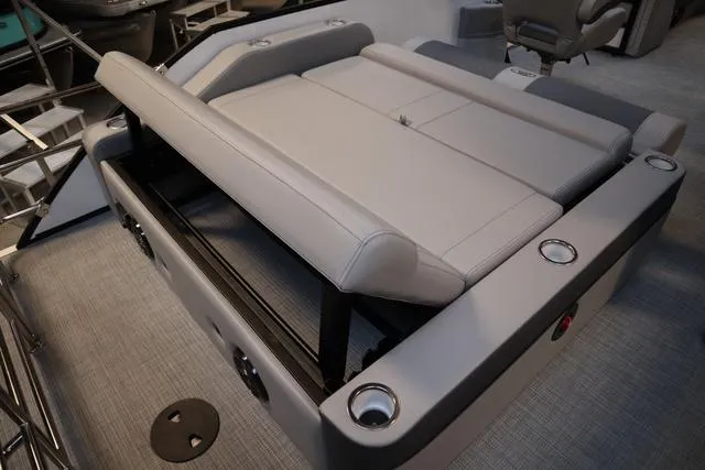 Slide: The Image of 2025 Bentley Pontoons Elite 253 Swingback interior with luxurious seating and cup holders. - 32