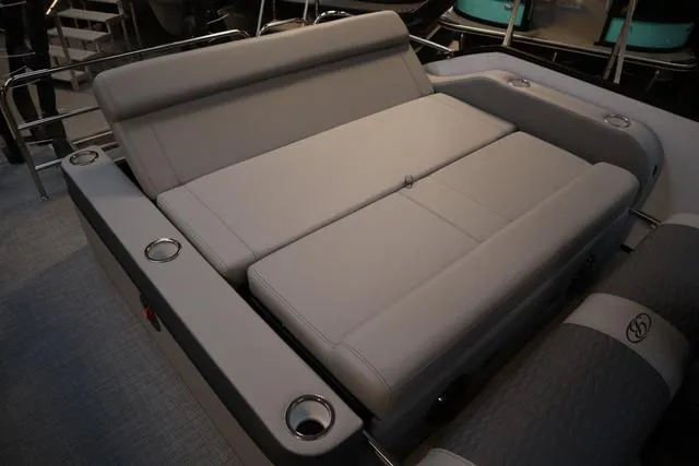 Slide: The Image of 2025 Bentley Pontoons Elite 253 Swingback interior with gray seating and cup holders. - 33