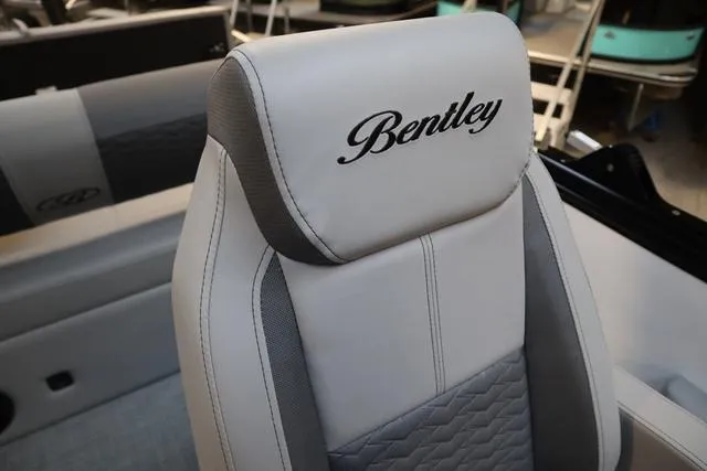 Slide: The Image of 2025 Bentley Pontoons Elite 253 Swingback seat with elegant stitching and logo. - 36