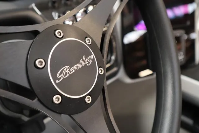 Slide: The Image of Steering wheel of 2025 Bentley Pontoons Elite 253 Swingback Triple Tube Pkg. - 38