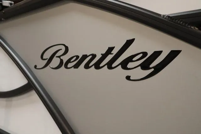 Slide: The Image of 2025 Bentley Pontoons Elite 253 logo on sleek boat exterior. - 39