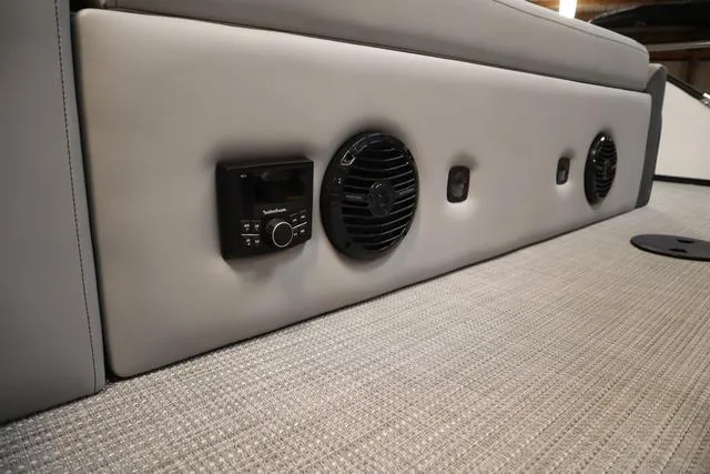 Slide: The Image of 2025 Bentley Pontoons Elite 253 interior with audio system and speakers. - 42
