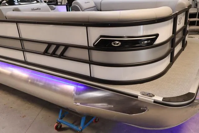 Slide: The Image of 2025 Bentley Pontoons Elite 253 Swingback Triple Tube, sleek design with ambient lighting. - 49