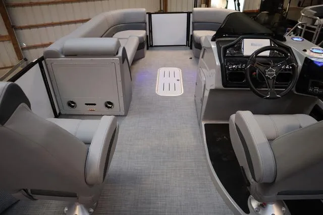 Slide: The Image of Interior of 2025 Bentley Pontoons Elite 253 Swingback, featuring luxurious seating and modern controls. - 7