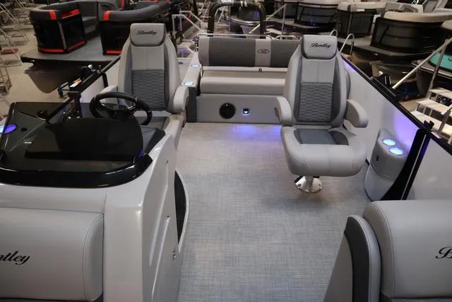 Slide: The Image of 2025 Bentley Pontoons Elite 253 Swingback interior with luxurious seating and modern design. - 8