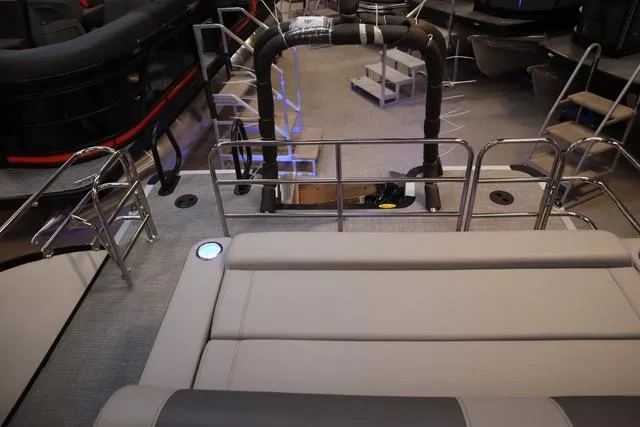 Slide: The Image of 2025 Bentley Pontoons Elite 253 Swingback interior with seating and railing. - 9