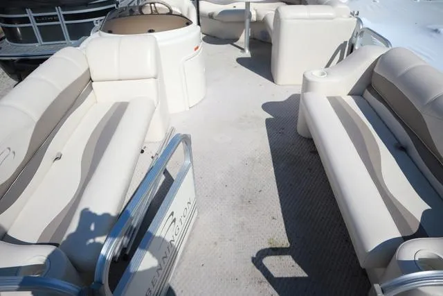 Slide: The Image of 2006 Bennington GL 2050 boat interior with beige seating and open layout. - 3