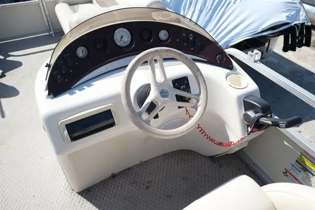 Slide: The Image of 2006 Bennington GL 2050 boat dashboard with steering wheel and control panel. - 8