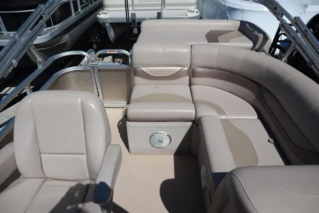 Slide: The Image of 2013 Avalon 1670 Fish boat interior with beige seating and spacious layout. - 5