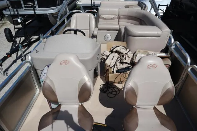 Slide: The Image of 2013 Avalon 1670 Fish boat interior with seating and steering console. - 6