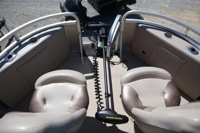 Slide: The Image of 2013 Avalon 1670 Fish boat interior with two seats and fishing equipment. - 7