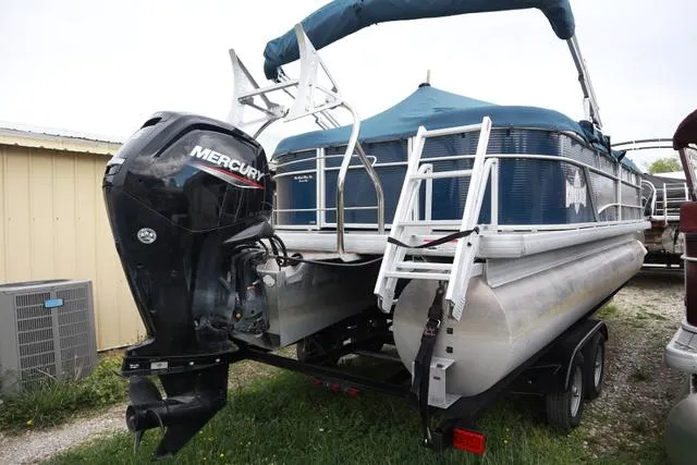 Slide: The Image of 2022 Sweetwater 2286SBX pontoon boat with Mercury outboard motor on trailer. - 4