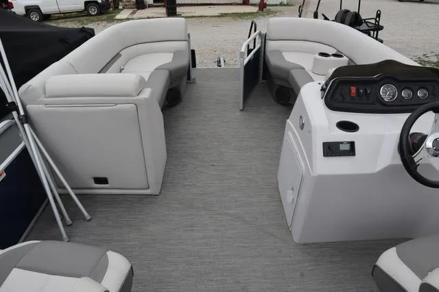 Slide: The Image of 2022 Sweetwater 2286SBX pontoon boat interior with spacious seating and modern dashboard. - 5
