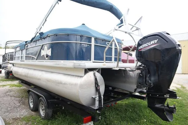 Slide: The Image of 2022 Sweetwater 2286SBX pontoon boat with Mercury outboard motor on trailer. - 8