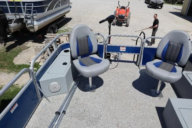 Slide: The Image of 2020 Lowe SF 214 pontoon boat interior with two swivel seats and storage compartments. - 5