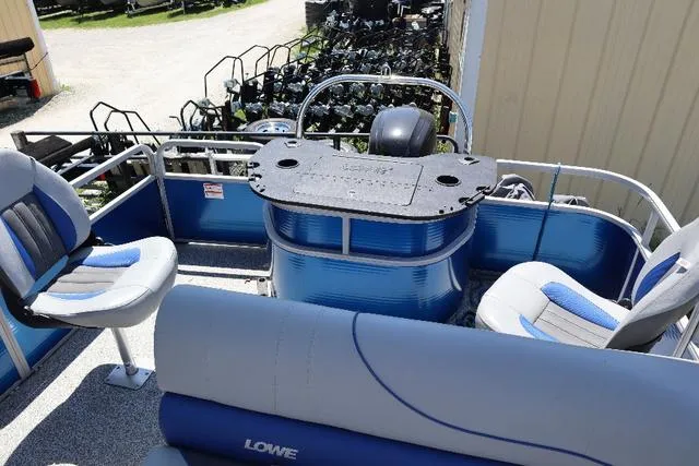 Slide: The Image of 2020 Lowe SF 214 pontoon boat interior with seating and control console. - 6