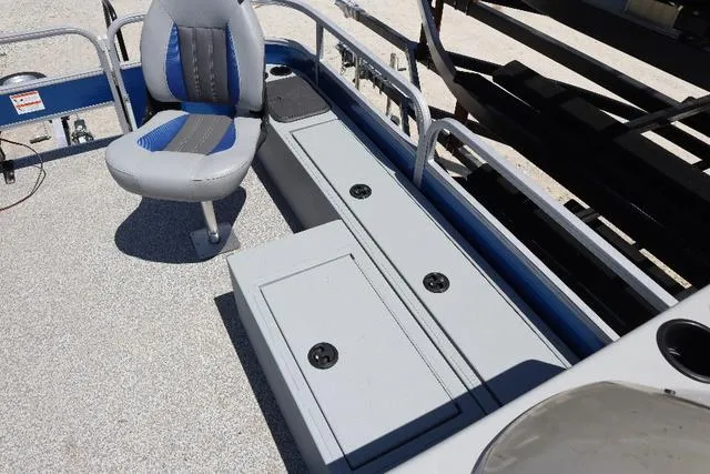 Slide: The Image of 2020 Lowe SF 214 boat interior with seating and storage compartments. - 7