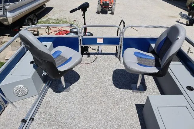 Slide: The Image of 2020 Lowe SF 214 boat interior with two swivel seats and a trolling motor. - 9