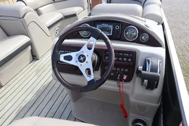 Slide: The Image of Steering console of 2017 Berkshire 23 E STS pontoon boat with modern controls. - 8
