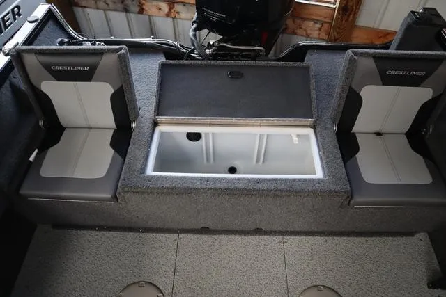 Slide: The Image of 2025 Crestliner 1750 HAWK SC JS boat interior with seating and storage compartment. - 3