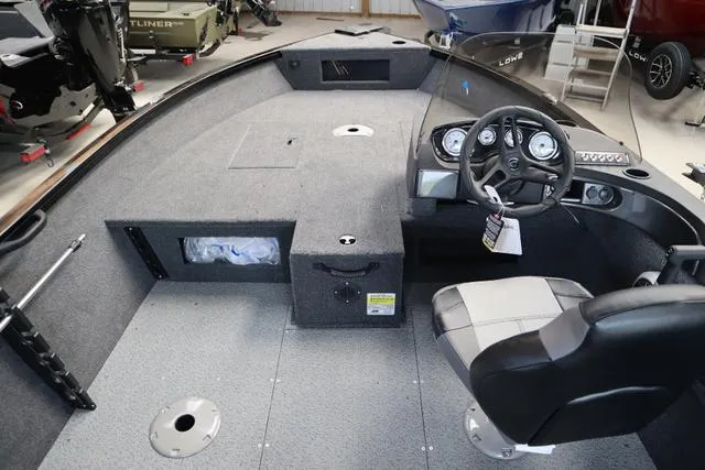 Slide: The Image of 2025 Crestliner 1750 HAWK SC JS boat interior with steering console and seating. - 4