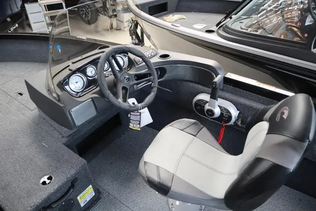 Slide: The Image of 2025 Crestliner 1750 HAWK SC JS boat interior with steering wheel and dashboard controls. - 6